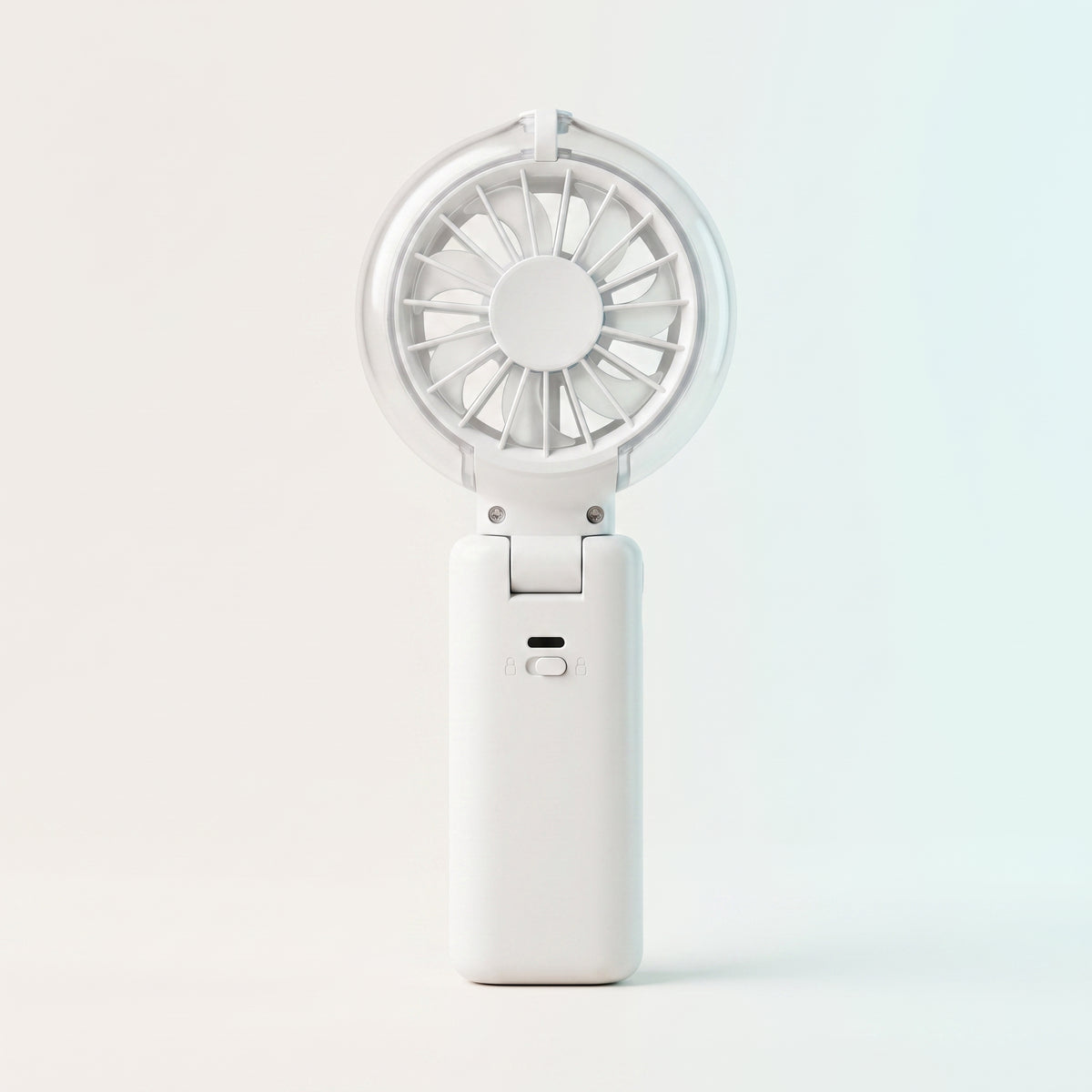 White handheld fan on a light gray background